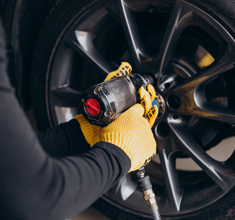 car mechanic changing car tyre